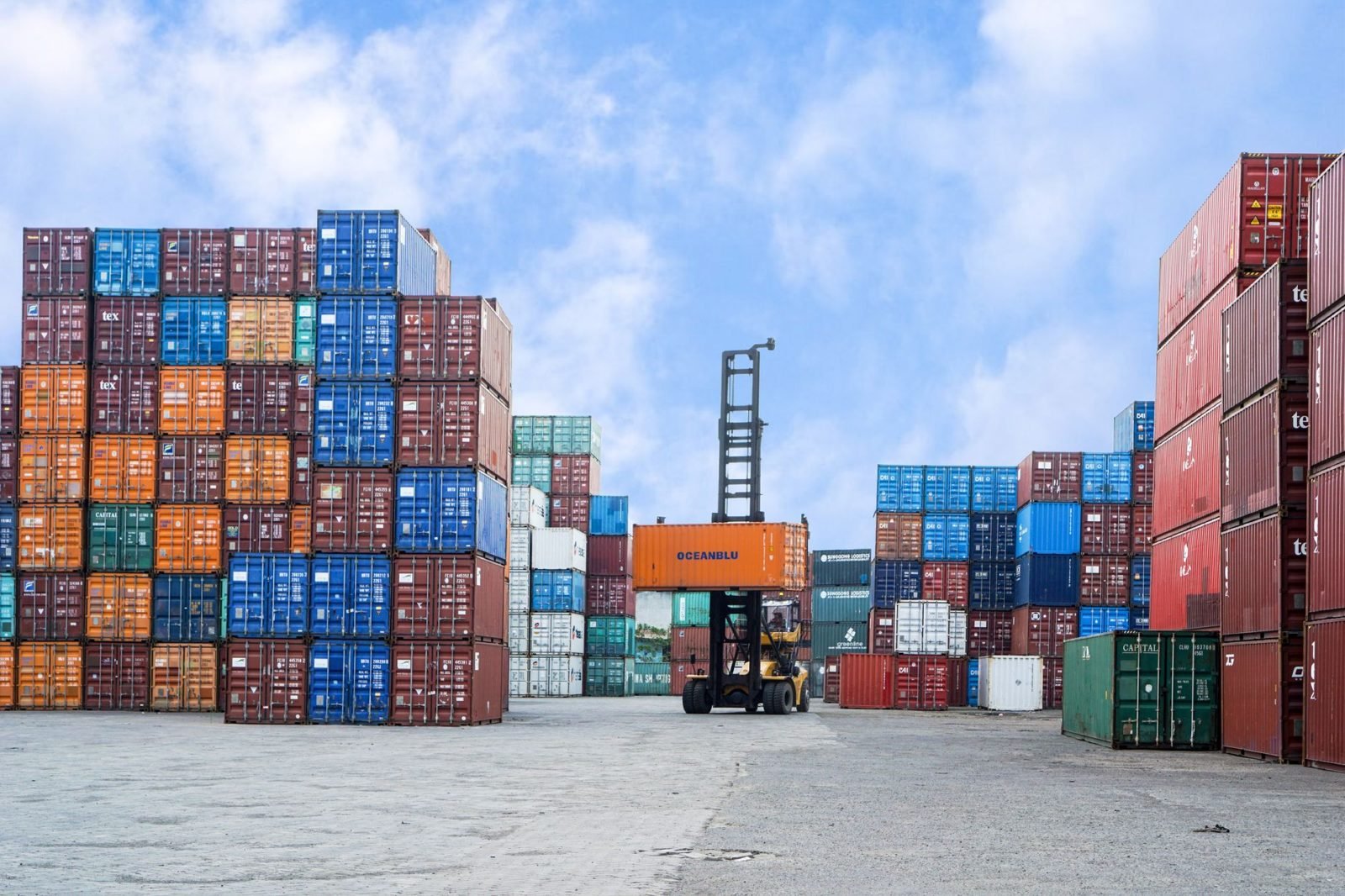 Shipping containers stacked at a port, the export freight where wood packaging rules apply